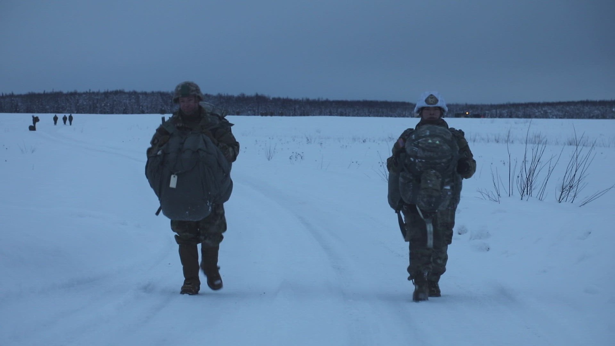 Sgt. Andrew Allen, paratrooper with the 4th Infantry Brigade Combat Team (Airborne), 25th Infantry Division, tests an experimental Airborne Sled to efficiently recover and move his combat equipment and used parachute to the assembly area on Malemute Drop Zone, Joint Base Elmendorf-Richardson, Alaska, December 9, 2021. The Airborne Sled is a project developed by SPARwerx, the brigade’s digital technology innovation cell that crowdsources innovators from across the brigade to develop internal technologies, systems, and concepts to maximize the welfare, safety and efficiency of Arctic paratroopers.