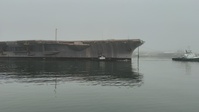 Ex-USS Kitty Hawk towed in its final transit from Naval Base Kitsap – Bremerton, Washington.