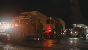 U.S. Soldiers unload humvees for Arctic Edge 22