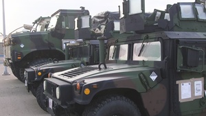 B-Roll Marines disembark JLTVs and chow from USNS Guam