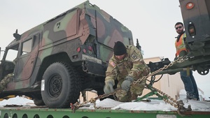 1-265th ADA unload Humvees for AE22