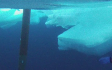 Divers recover test torpedo during ICEX 2022