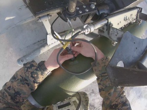 U.S. Marines arm attack helicopters during Cold Response 2022