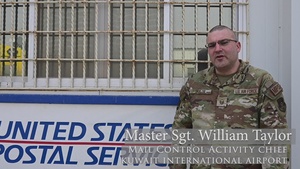 Shipping a piece of home overseas: service members work together to deliver mail