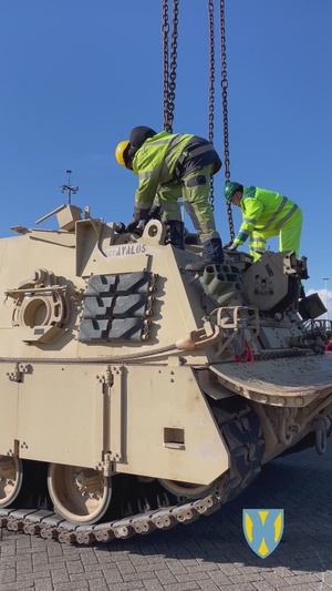 M88A2 Hercules recovery vehicle is hoisted and loaded onto a train