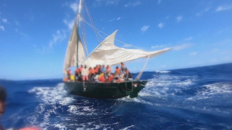 Coast Guard Cutter Campbell's law enforcement small boat crew transfer Haitian migrants from an unsafe and unstable sailing vessel to their boat, approximately 33 miles off Isle de Tortue, Haiti, April 30, 2022. The people were repatriated May 3, 2022. (U.S. Coast Guard video by Cutter Campbell's crew)