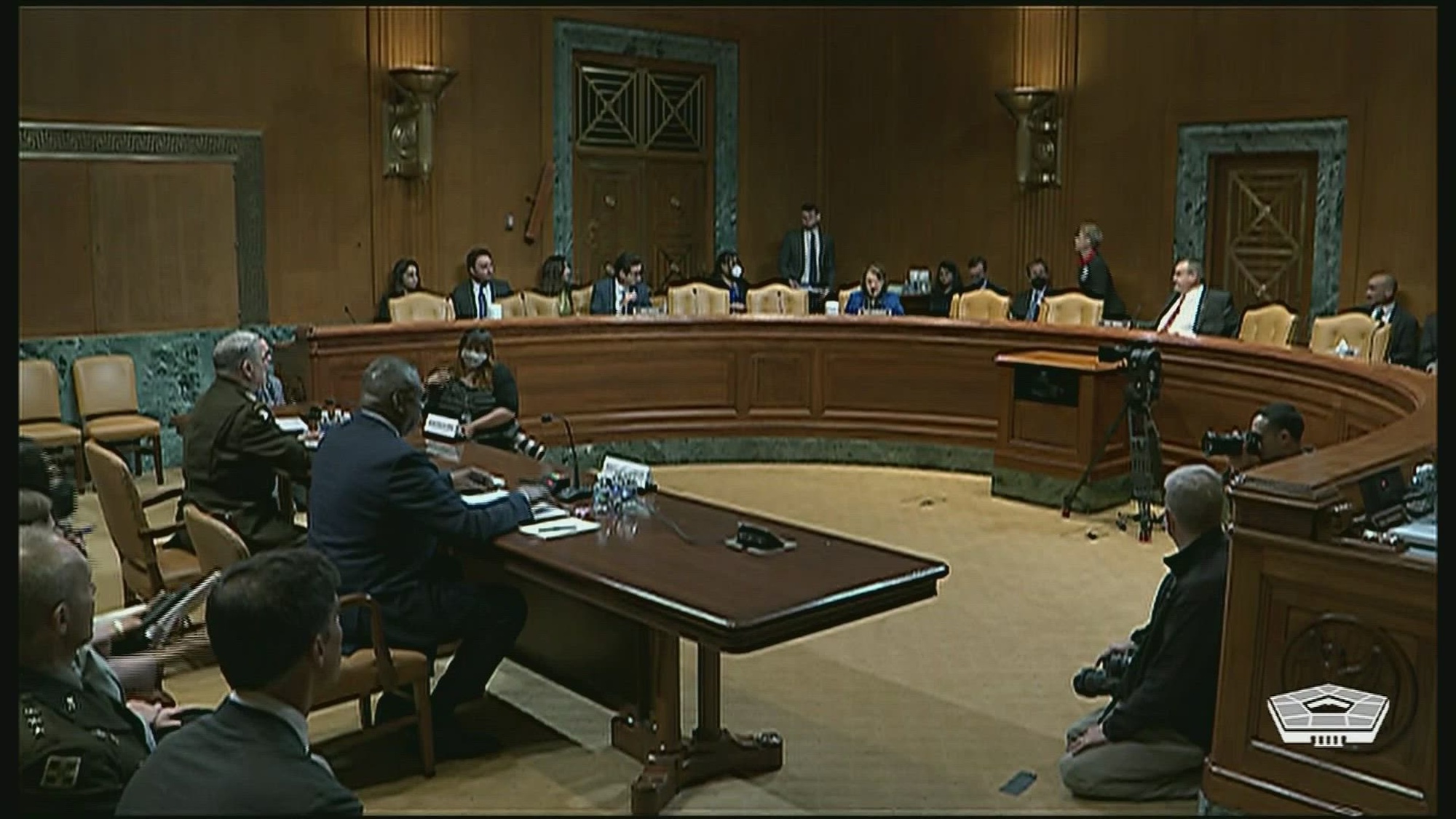 Secretary of Defense Lloyd J. Austin III and Army Gen. Mark A. Milley sit in front of a panel of senators. 