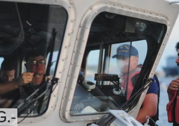 Crewmembers from Coast Guard Station Portsmouth patrol Elizabeth River during Harborfest fireworks celebration in Norfolk, Virginia