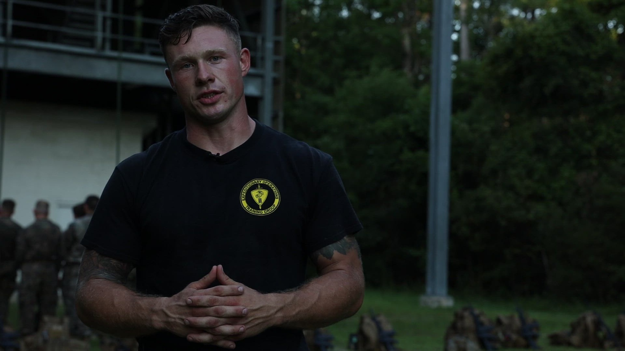 U.S. Marine Corps Sgt. Justin Andler, a ropes and recovery instructor with Expeditionary Operations Training Group, is interviewed about static fast rope tower training in order to facilitate greater partner and ground forces integration at Camp Lejeune, North Carolina, July 6, 2022. Burmese Chase is a longstanding fire support exercise hosted by 2nd Air-Naval Gunfire Liaison Company focused on improving combat readiness and strengthening relationships with allies and partners. (U.S. Marine Corps video Lance Cpl. Aziza Kamuhanda)