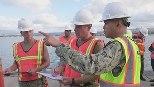 U.S. contractors and U.S. Navy Sailors onload USNS Kaiser for upcoming RAS