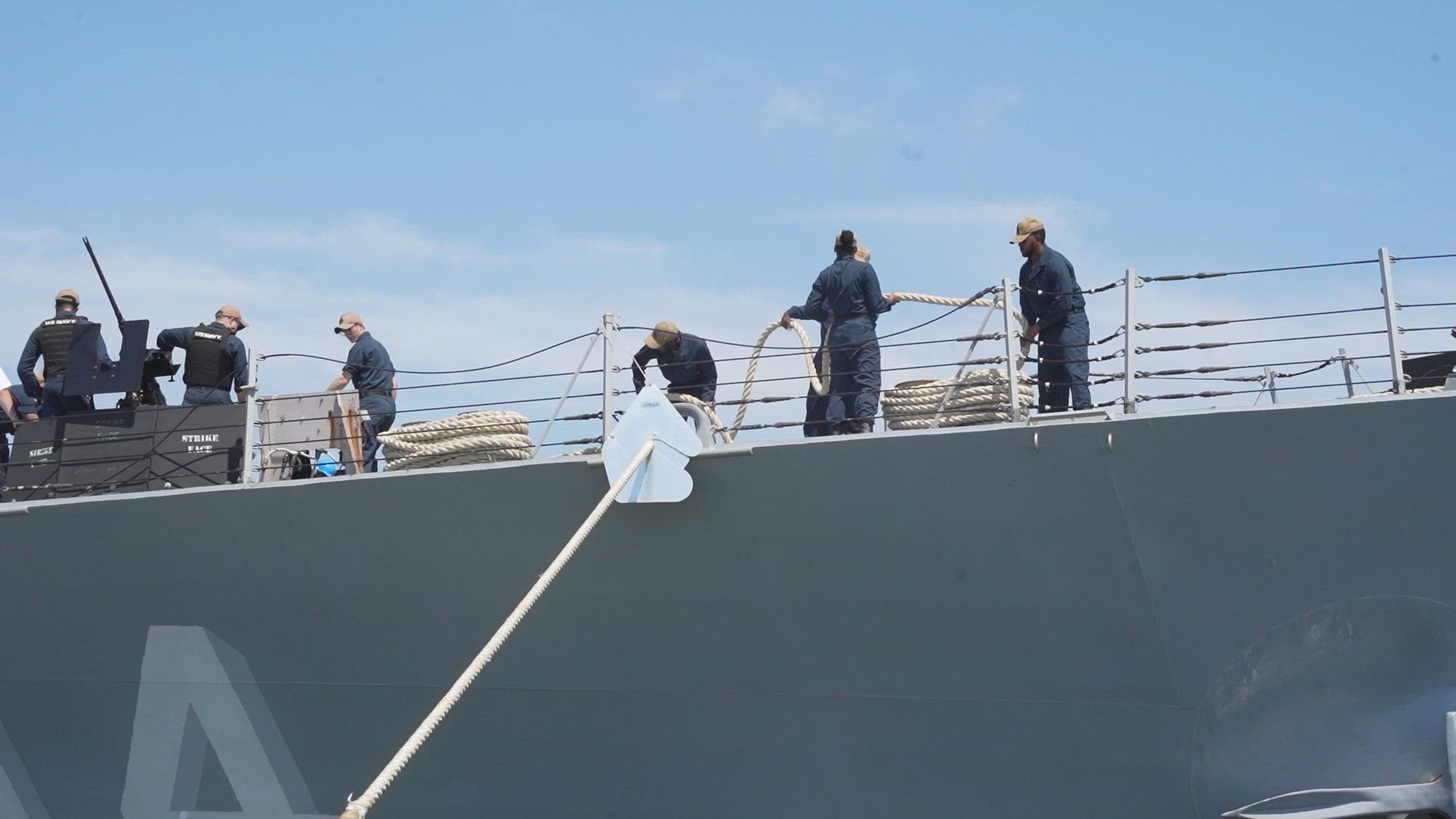 NORFOLK (July 17, 2022) Sailors take in lines and man the rails aboard the Arleigh Burke-class guided-missile destroyer, USS Nitze (DDG 94), July 17. Nitze, assigned to the George H.W. Bush Carrier Strike Group, departed her homeport of Naval Station Norfolk on a scheduled independent deployment. (U.S. Navy video by Mass Communication Specialist 1st Class Ryan Seelbach)