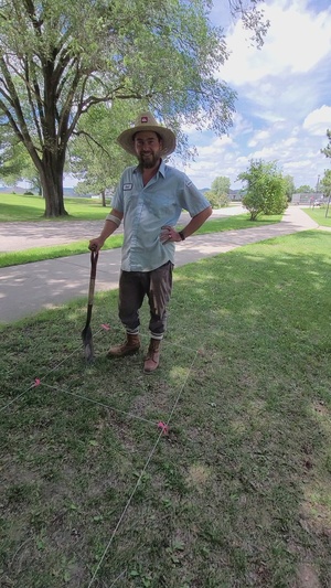 Archaeologist Tyler Olsen explains archaeology work while working special 2022 Fort McCoy dig