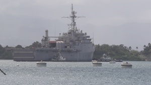 Former USS Denver towed out to sea