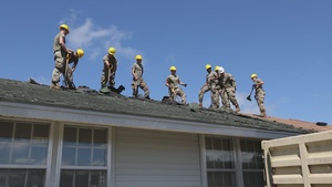 National Guard Soldiers Deschingle Roof