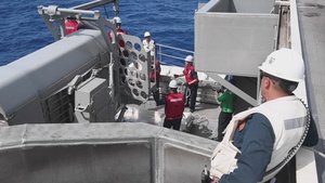 Abraham Lincoln Sailors conduct a missile download