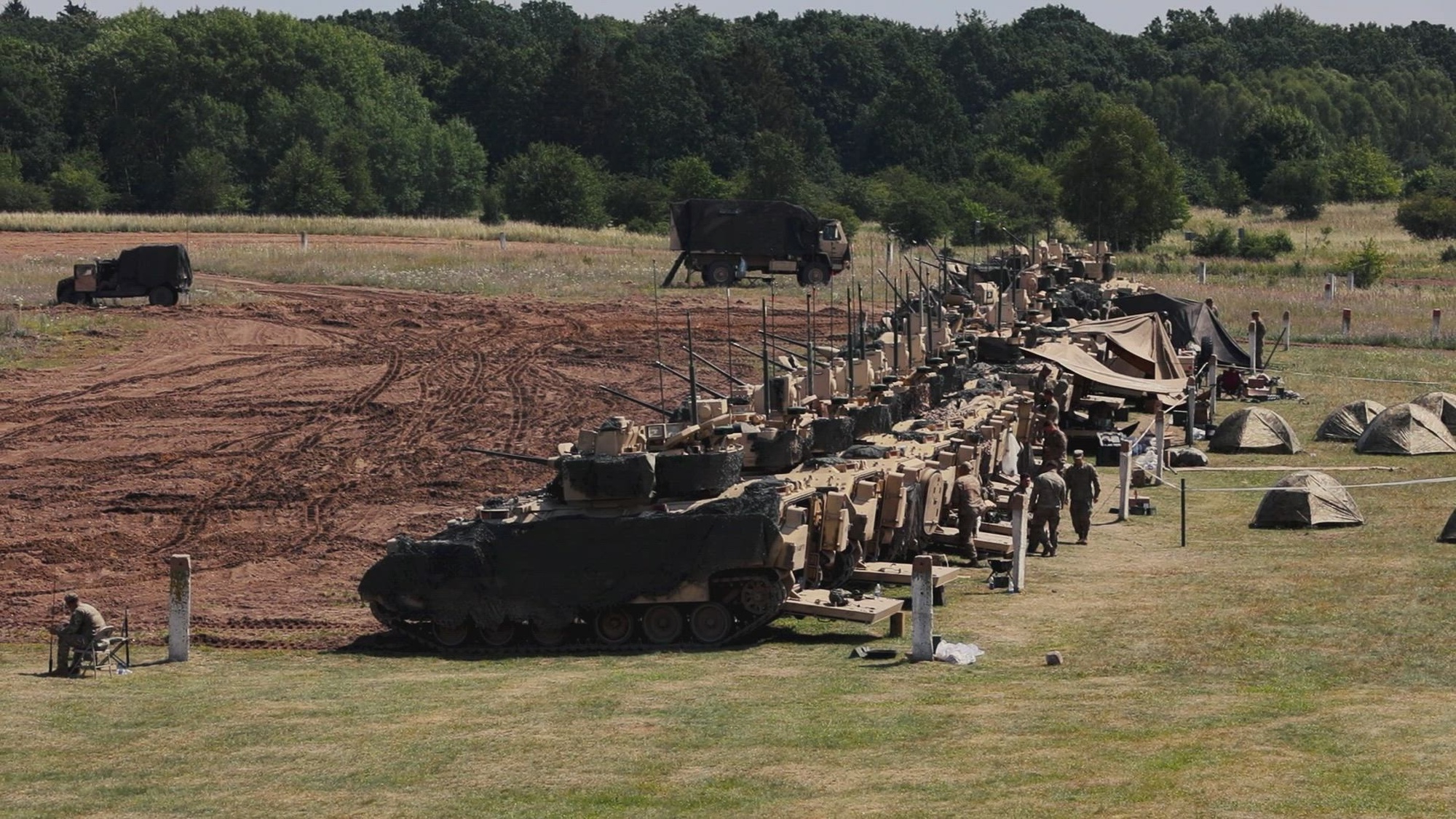 U.S. Soldiers assigned to Chaos Company, 1st Battalion, 68th Armor Regiment, 3rd Armored Brigade Combat Team, 4th Infantry Division, conduct an M2A3 Bradley Fighting Vehicle gunnery table VI at Drawsko Pomorskie, Poland, July 27, 2022. The 3rd Armored Brigade Combat Team, 4th Infantry Division, is among other units assigned to 1st Infantry Division, proudly working alongside NATO allies and regional security partners to provide combat-credible forces to V Corps, America’s forward-deployed corps in Europe. (U.S. Army National Guard Video by Staff Sgt. Gabriel Rivera)