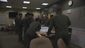 Marines with Marine Light Attack Helicopter Squadron (HMLA) 167 discuss flight operations