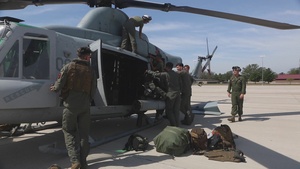 Marines with Marine Light Attack Helicopter Squadron (HMLA) 167 inspect and perform maintenance on a UH-1Y Venom