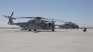 Marines with Marine Heavy Helicopter Squadron (HMH) 461 prepare ordnance