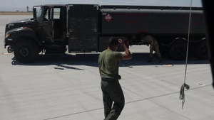 Marines with Marine Heavy Helicopter Squadron (HMH) 461 and Airmen refuel a CH-53K King Stallion