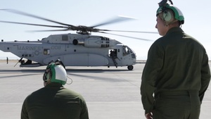 U.S. Marines with Marine Heavy Helicopter Squadron (HMH) 461 shoot .50-caliber machine guns