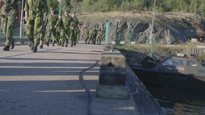 U.S. Marines follow safety demonstrations aboard a Swedish Combat Boat 90