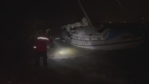 Coast Guard crews rescue man, dog from grounded sailboat off Florida Keys