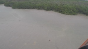 Coast Guard aircrew searches for people in the water off Stock Island, Florida