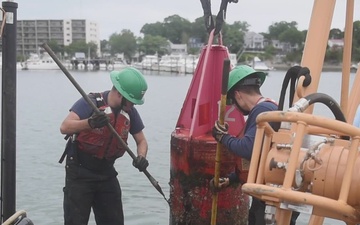 U.S. Coast Guard Aids to Navigation Team Boston works Buoy 12