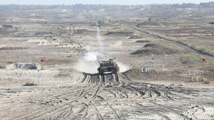U.S. and Polish Armies maneuver tanks during live fire in Nowa Deba