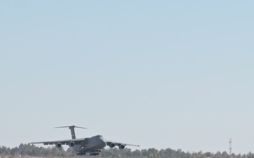 Airmen Unload Cargo Off A C-5M Super Galaxy
