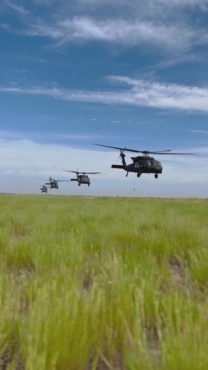 B-Roll of four UH-60 Black Hawks taking off