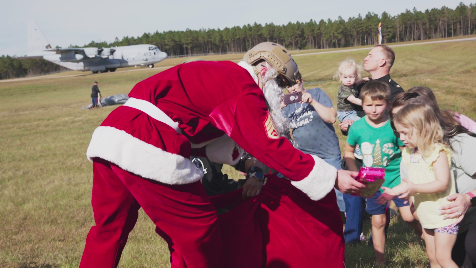 U.S. Marines assigned to 3rd Force Reconnaissance Company, 4th Marine Division, Marine Forces Reserve conduct parachute operations in their dress blue uniforms with help from Santa to delivery toys and raise awareness for the annual U.S. Marine Corps Reserve Toys for Tots Program, at Camp Shelby, Mississippi, November 10, 2022. Toys for Tots, a 75-year national charitable program run by the U.S. Marine Corps Reserve, provides happiness and hope to less fortunate children during each Christmas holiday season. The toys, books, and other gifts collected and distributed by the Marines offer these children recognition and a positive memory for a lifetime. (U.S. Marine Corps video by Cpl. James Stanfield)

The music within the following video production is copyright material used under license with HookSounds contract dated 1 Dec 2021.
