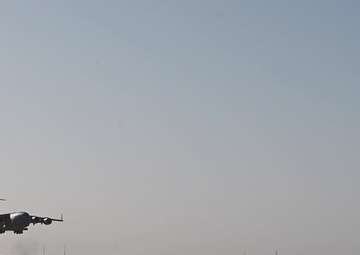 B-roll of a C-17 landing at AB 201