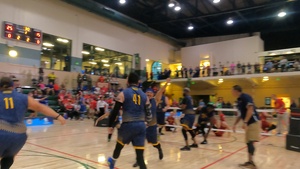 Team Navy Sitting Volleyball Team cheering after a win