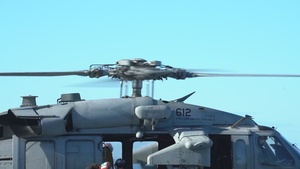 Abraham Lincoln conducts a vertical replinishment with USNS Richard E. Byrd