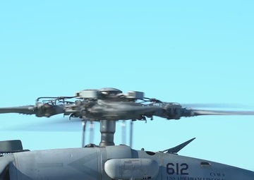 Abraham Lincoln conducts a vertical replinishment with USNS Richard E. Byrd