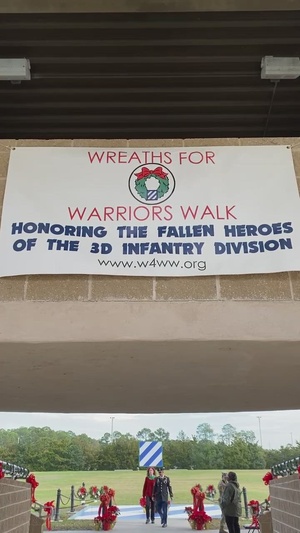 Soldiers, Family, community place wreaths on Warriors Walk