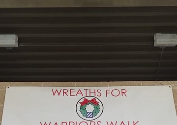 Soldiers, Family, community place wreaths on Warriors Walk