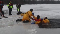 Fort McCoy Firefighters train on surface ice rescue skills at frozen installation lake