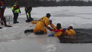 Fort McCoy Firefighters train on surface ice rescue skills at frozen installation lake