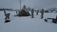 Airmen learn to build Arctic 10-person tents during cold-weather training at Fort McCoy