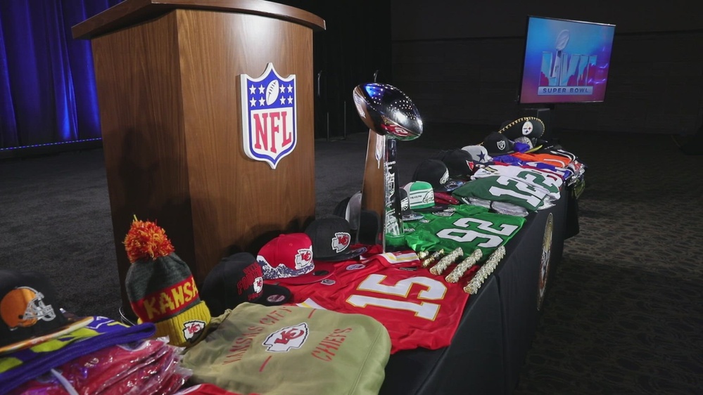 National Football League fans survey the souvenir items at the NFL shop at  the NFL Experience in the Indianapolis Convention Center in downtown  Indianapolis, Indiana on February 3, 2012. Hats cost $40. The New England  Patriots play the New York