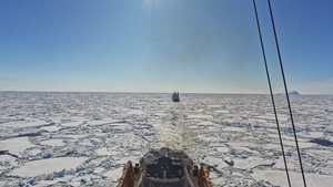 Coast Guard Cutter Polar Star (WAGB 10) escorts motor vessel Ocean Giant in McMurdo Sound for Operation Deep Freeze