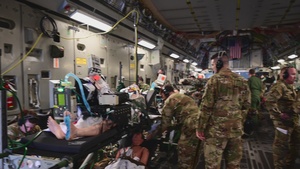 B-Roll of tail-to-tail transfer of patients from a C-17 Globemaster III to UH-60 Black Hawk