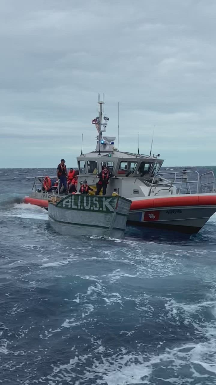 Coast guard helicopter conducting search and rescue operations over ocean waters