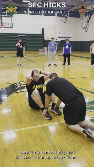 Sgt. 1st Class Hicks conducts PT with students