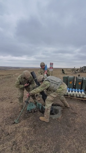 B-Roll - Task Force Tomahawk Soldiers fire 120mm mortars - Vertical