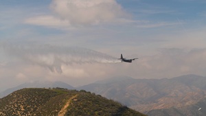 Air National Guard C-130Hs and U.S. Forest Service lead planes practicing MAFFS water drops (2of2)