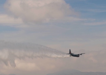 Air National Guard C-130Hs and U.S. Forest Service lead planes practicing MAFFS water drops (2of2)